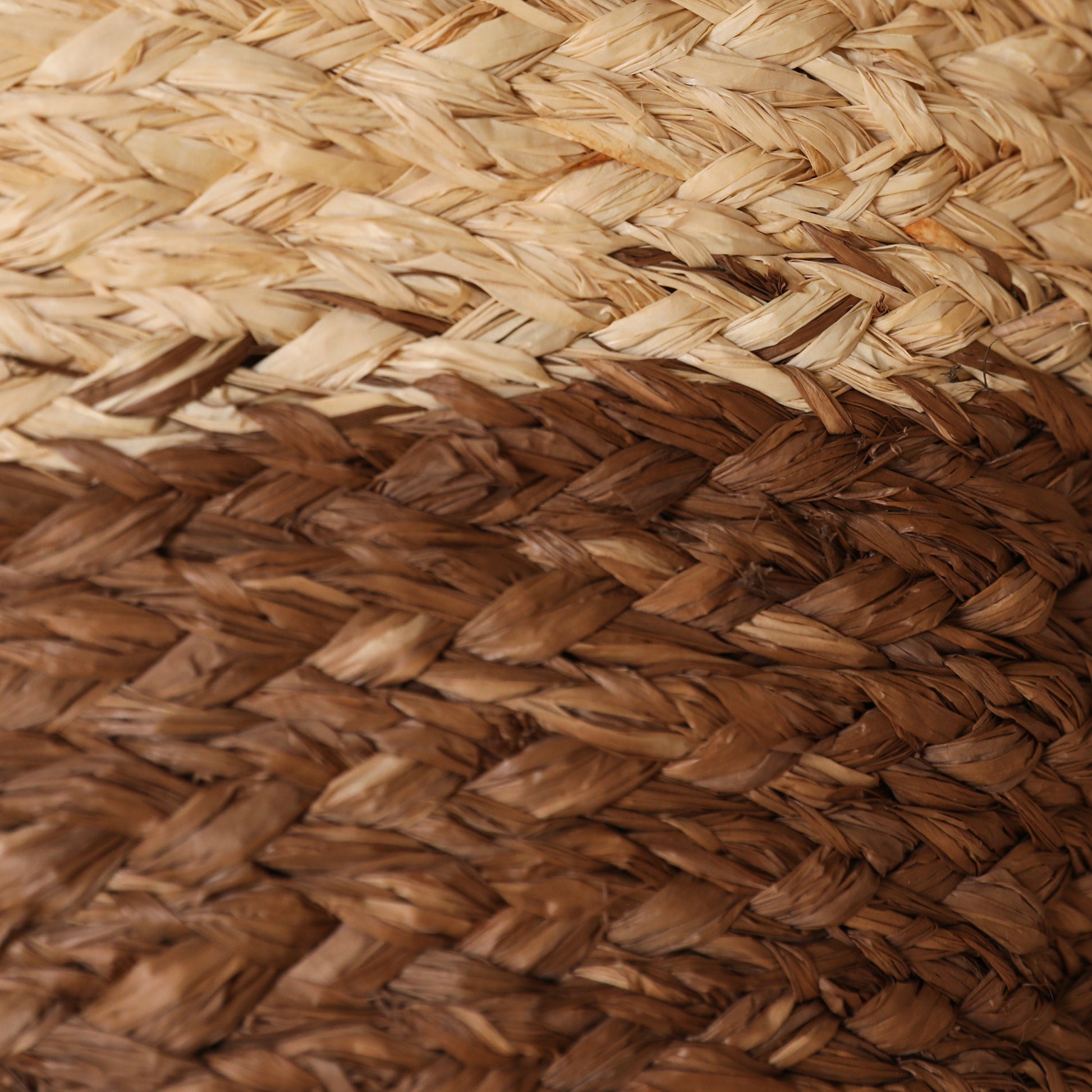 Close-up of a raffia plait section of a bag, brown and natural colour raffia