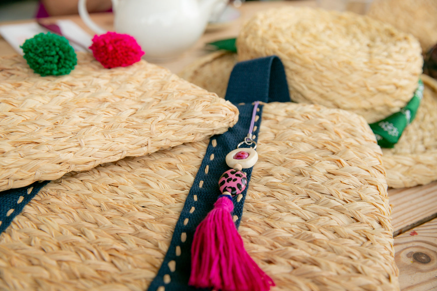 Collection of handmade raffia bags and hat
